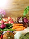 Freshly picked harvest of different autumn vegetables and fruit on a wooden background Royalty Free Stock Photo