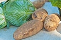 Freshly picked, head of cabbage and potatoes at a farmers marked Royalty Free Stock Photo