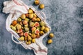 Freshly picked organic green figs in a basket on grey background Royalty Free Stock Photo