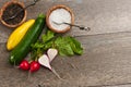 Top view of freshly picked vegetables and bowls of sea salt and pepper corns Royalty Free Stock Photo