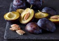 Freshly picked plums on dark table Royalty Free Stock Photo