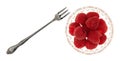 Freshly picked raspberries in a small glass bowl with a fruit fork to the side on a white background