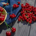 Freshly picked ripe berries of redcurrant close-up on a wooden table Royalty Free Stock Photo