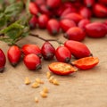 Freshly picked rose hips on the wooden table. Rose hip commonly known as rose hip Rosa canina Royalty Free Stock Photo