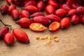 Freshly picked rose hips on the wooden table. Rose hip commonly known as rose hip Rosa canina Royalty Free Stock Photo