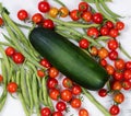 Freshly picked uncleaned vegetables on marble stone countertop Royalty Free Stock Photo