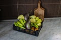 Freshly picked vegetables in a plastic crate, on the kitchen table. Fresh vegetables grown in the garden. Different types of Royalty Free Stock Photo