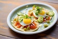 freshly plated huevos rancheros with a golden crispy tortilla edge