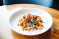 freshly plated roasted squash salad, blue cheese, walnuts, bacon bits