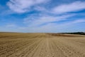 freshly ploughed brown farm field. undulating hilly rural land. abstract perspective view