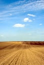 freshly ploughed brown farm field. undulating hilly rural land. abstract perspective view