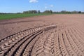 Freshly plowed earth on farm field