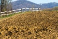 Freshly plowed field on a farm in the mountains Royalty Free Stock Photo