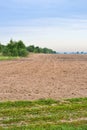 Freshly Plowed Field In Spring Ready For Cultivation. Spring landscape in the countryside with fields against the sky. Agriculture Royalty Free Stock Photo