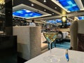 A freshly poured glass of Chardonnay wine in The Haven dining room on the Norwegian Escape cruise ship Royalty Free Stock Photo
