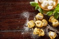 Freshly prepared uncooked handmade tortellini