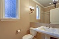 Freshly renovated bathroom interior with white washstand.