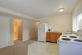 Freshly renovated L-shaped kitchen with tile flooring