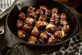 Freshly roasted chestnuts in cast iron skillet Royalty Free Stock Photo