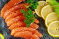Freshly salmon with lime, avocado on a marble plate horizontal Royalty Free Stock Photo