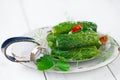 Freshly-salted cucumbers on vintage enamel sieve