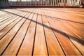 freshly sealed wooden deck in bright sunlight