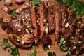 Freshly seared medium rare sirloin steak on the chopping board