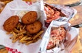 Freshly served delectable and iconic New England style lobster roll with butter