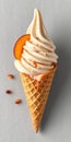 Delicious soft serve ice cream in a waffle cone with peach topping and almond flakes on the side