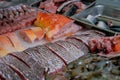 Freshly sliced and freshly caught various seafoods put on display for sale in a supermarket