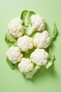 Freshly Sliced Cauliflower on Vibrant Green Background AI Generated