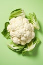 Freshly Sliced Cauliflower on Vibrant Green Background AI Generated