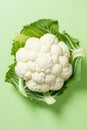 Freshly Sliced Cauliflower on Vibrant Green Background AI Generated