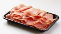 Freshly sliced deli ham presented in a black plastic tray Royalty Free Stock Photo