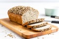 freshly sliced gluten-free multigrain bread on a board