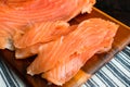 Freshly Sliced Lox on a Wooden Cutting Board Royalty Free Stock Photo