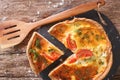 Freshly sliced pie with feta, tomatoes and herbs closeup. horizontal top view Royalty Free Stock Photo