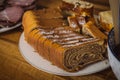 Freshly sliced potica, traditional slovenian festive dish on a table and plate for easter celebration