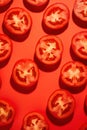 Freshly Sliced Tomato on Vibrant Red Background AI Generated