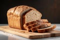 Freshly sliced wheat bread on a clean white kitchen board