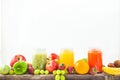 Freshly squeezed fruit juice, smoothies yellow orange green blue banana lemon apple orange kiwi grape strawberry on a white isolat Royalty Free Stock Photo