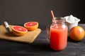 Freshly squeezed grapefruit juice in a jar with a handle.