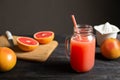 Freshly squeezed grapefruit juice in a jar with a handle.