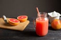 Freshly squeezed grapefruit juice in a jar with a handle.