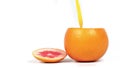 Freshly squeezed juice is poured into a grapefruit