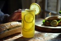 freshly squeezed lemonade, person with baguette sandwich, beam of morning sun