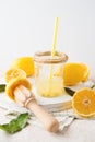 Freshly squeezed natural lemon juice in a glass jar on a white background Royalty Free Stock Photo