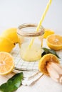 Freshly squeezed natural lemon juice in a glass jar on a white background Royalty Free Stock Photo