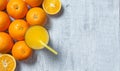 Freshly squeezed orange juice in glass with orange fruits on wooden background Royalty Free Stock Photo