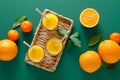 Freshly squeezed orange juice in a glass pitcher and fresh fruits with leaves, healthy drink, vitamin c concept, top view Royalty Free Stock Photo